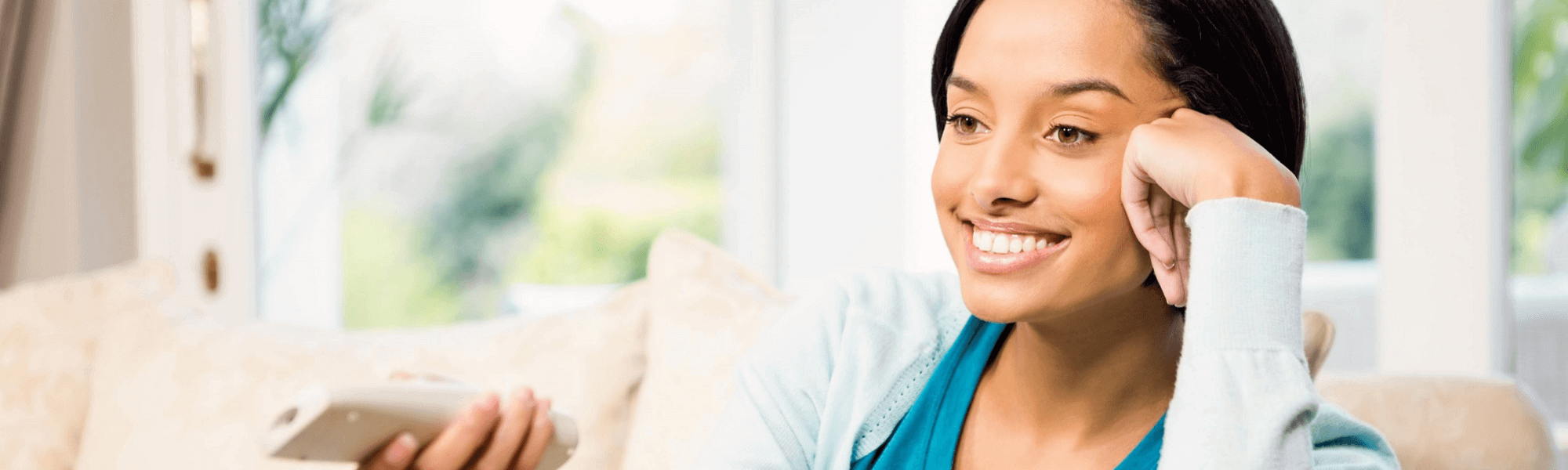 Woman on couch with remote